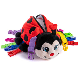 Becky Ladybug stuffed animal with six buckles for fine motor play.