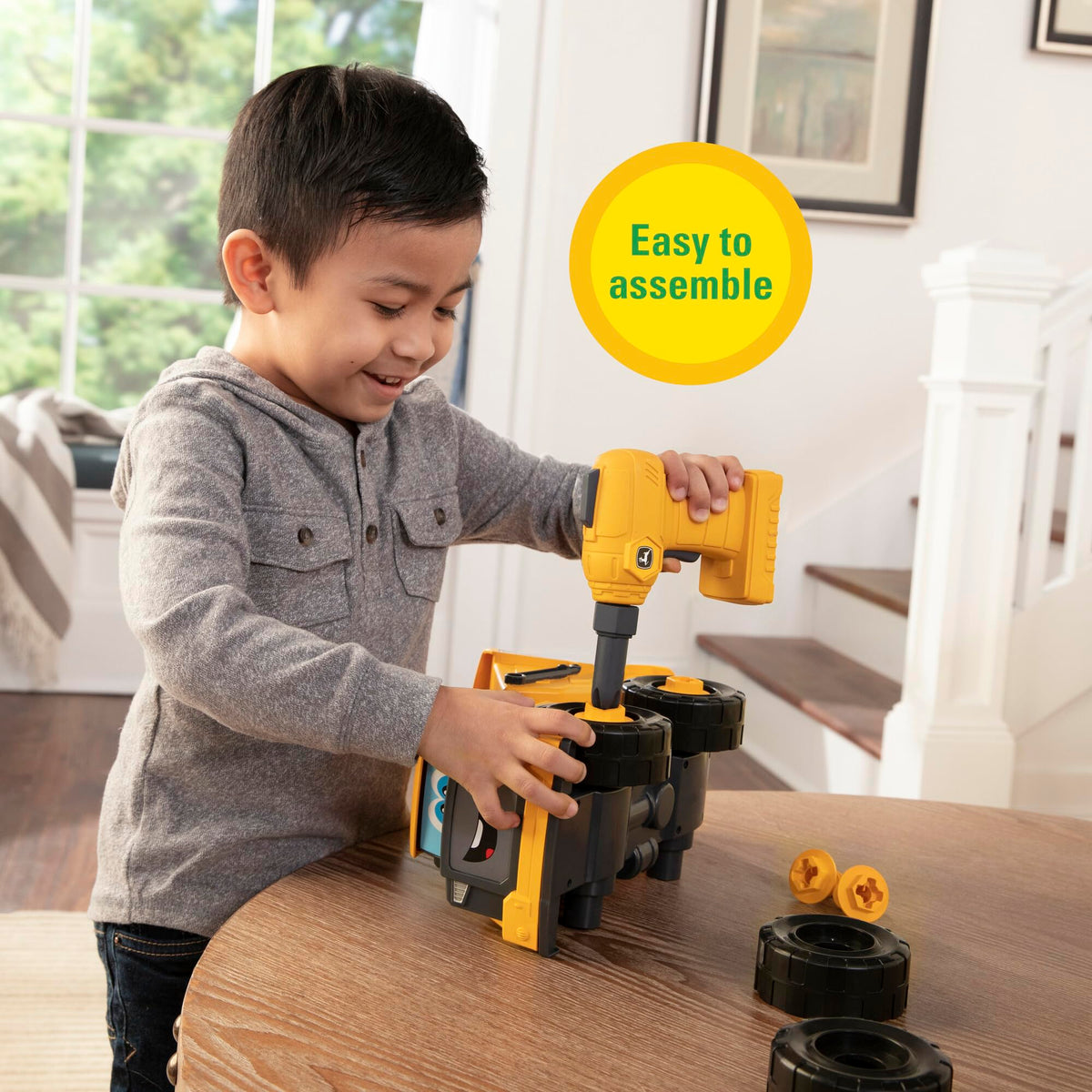Build-A-Buddy John Deere Dump Truck drill demonstrates spinning action for assembly.