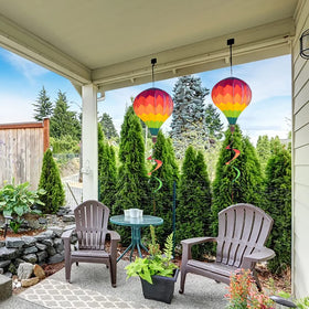 BusyLittleBee rainbow balloons decorate porches, trees, and balconies.