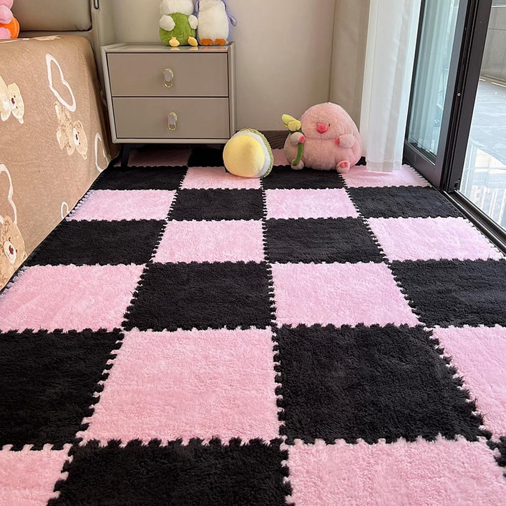BXEBUI pink and black puzzle mats interlock for a soft play area.