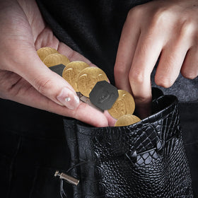 Coins feature four shapes—circle, octagon, triangle, moon—for visual variety.