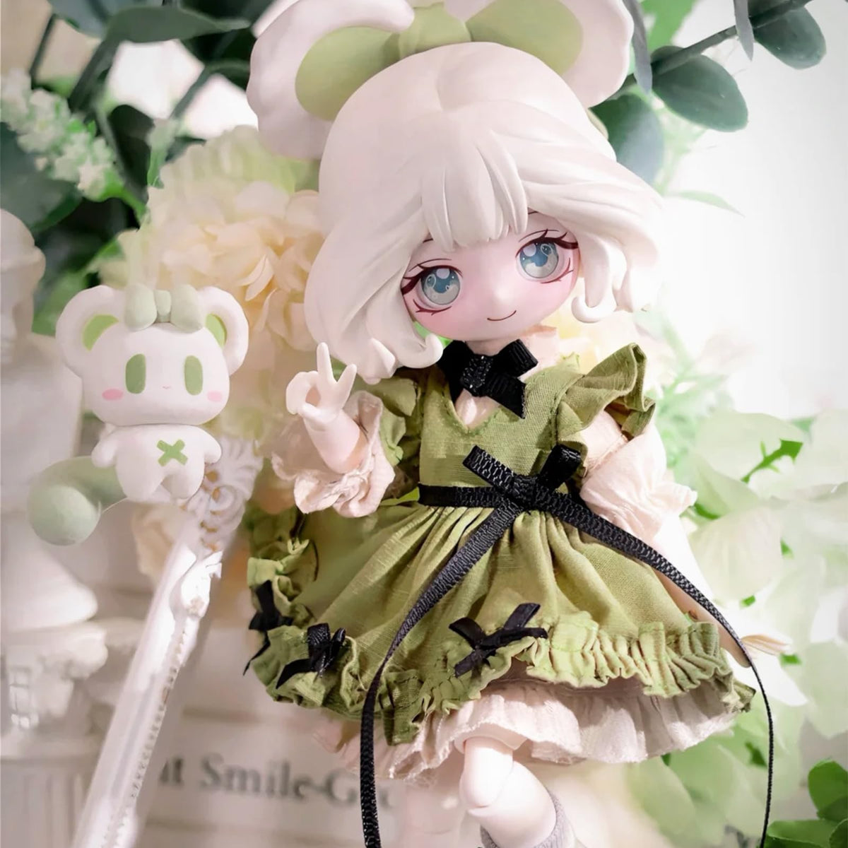 CALEMBOU Lulu Elf 8-inch doll in poseable arm pose.