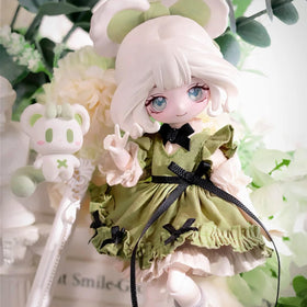 CALEMBOU Lulu Elf 8-inch doll in poseable arm pose.