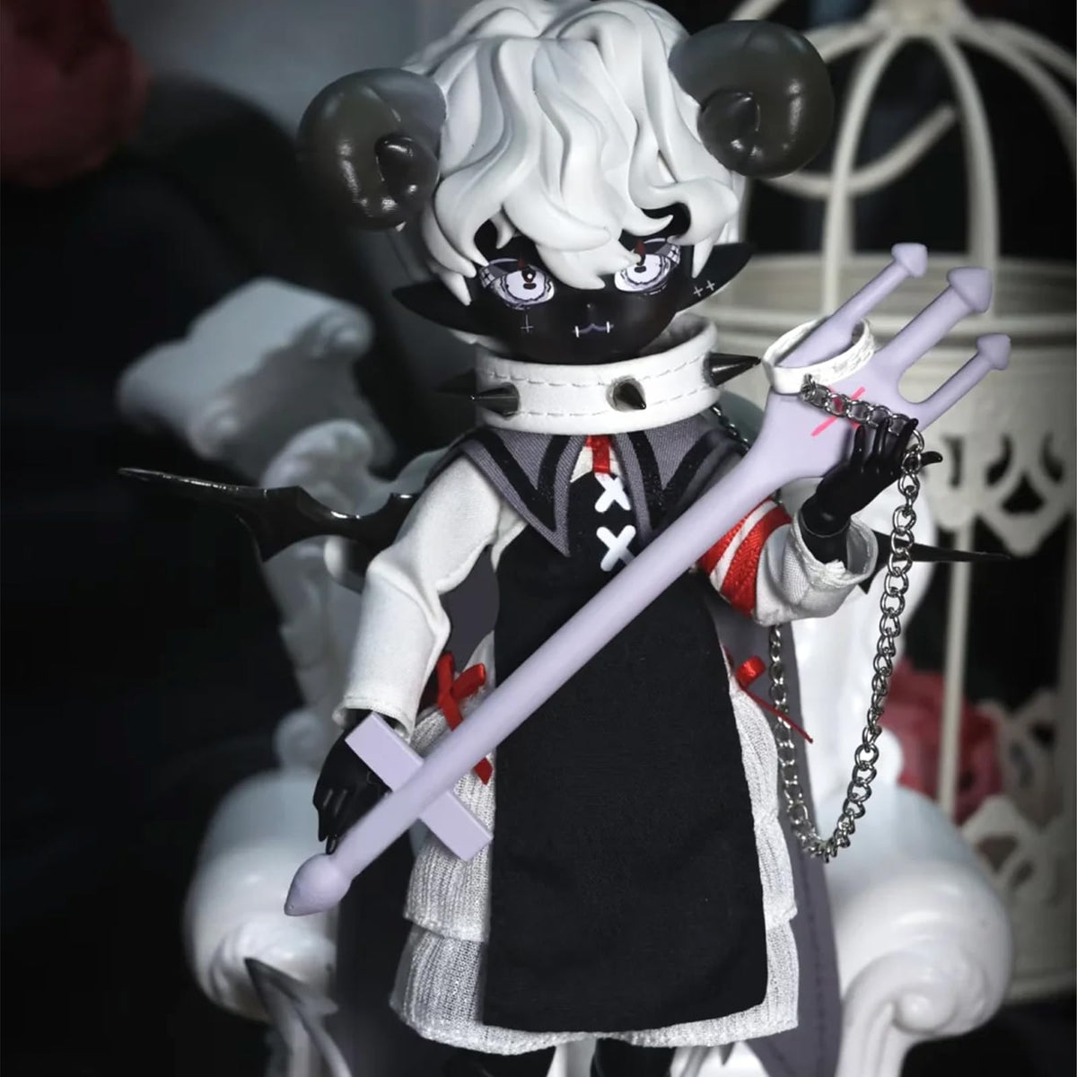 CALEMBOU horned doll showcasing accessory style for display.