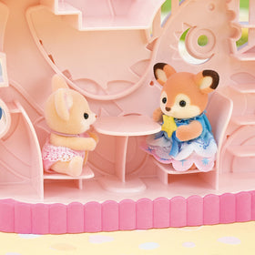 Calico Critters Creme baby figure in fairytale princess outfit ready for storytelling.