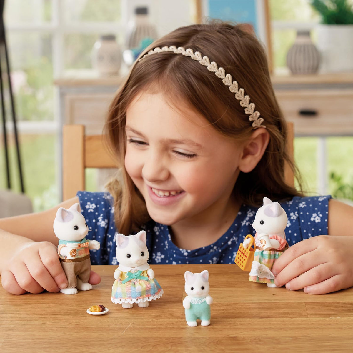 Calico Critters Latte Cat Baby Pino, cheerful shopper sparks early commerce play.