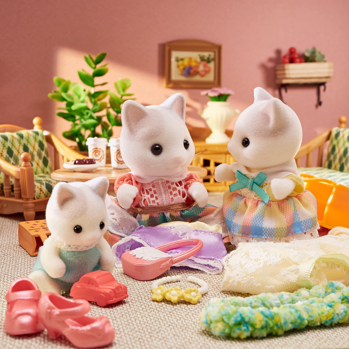 Calico Critters Latte Cat figures holding drinks for interactive storytelling.