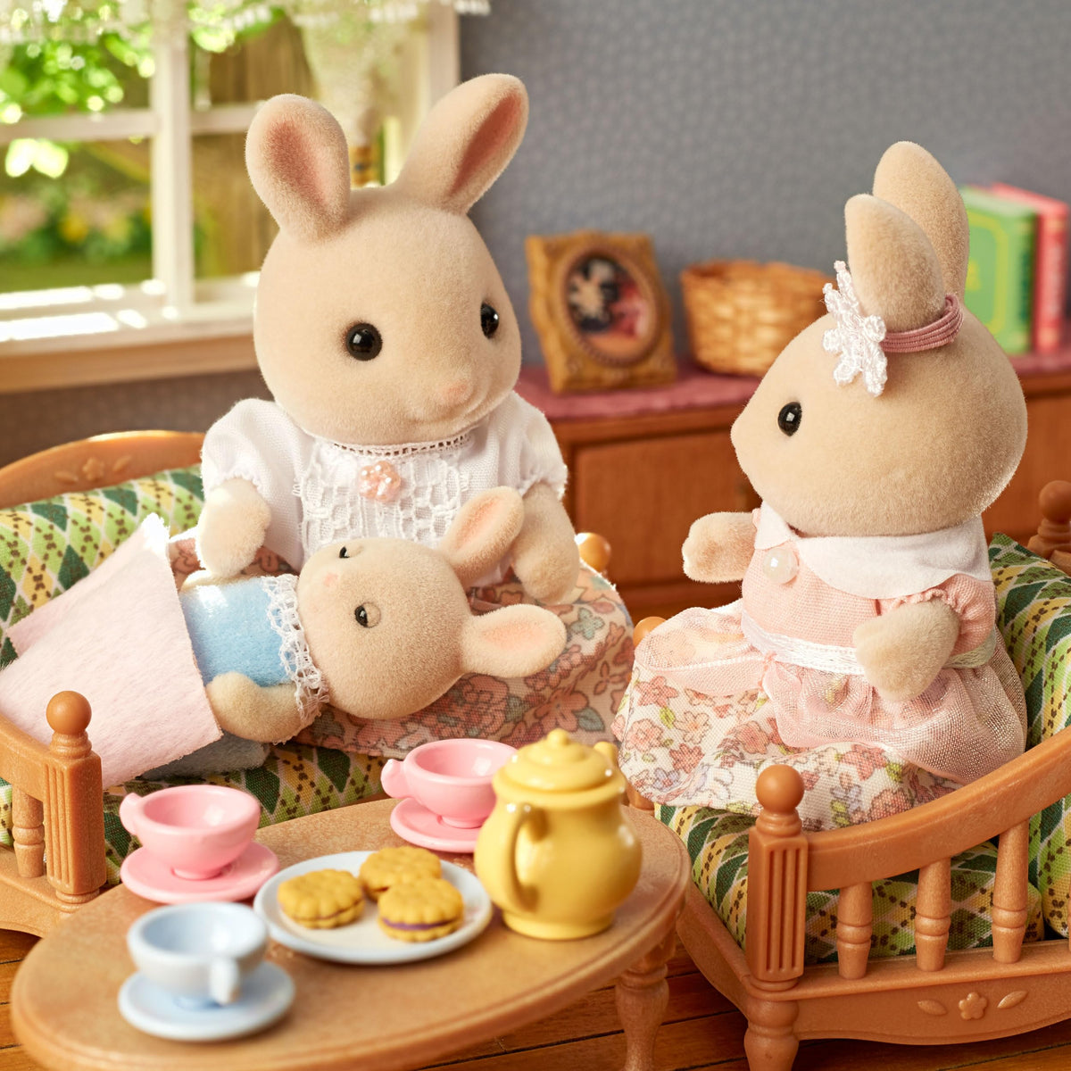 Calico Critters Milk Rabbit Family sizes shown for adults and little hands