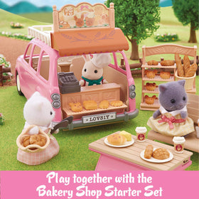 Calico Critters pink vehicle pairs with Cozy Cottage sets for storytelling.