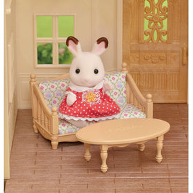 Calico Critters Red Roof Cozy Cottage kitchen area with stove and sink for pretend meals.