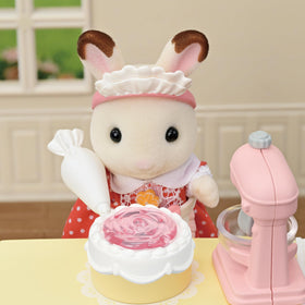 Calico Critters Village Cake Shop bakery setup pairs with Red Roof Cozy Cottage