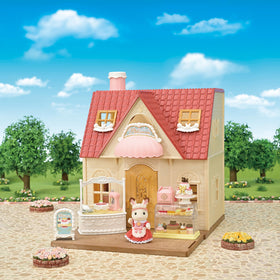Calico Critters Village Cake Shop two-tier cake highlights celebratory baking play and storytelling
