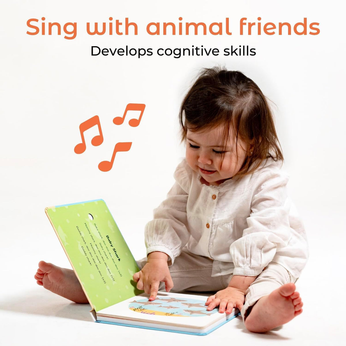 Cali's Books Baby Shark Music Book sound button close-up highlights cause-and-effect play.