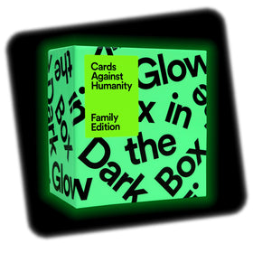 Cards Against Humanity box opening showcases organized compartments for easy card access.