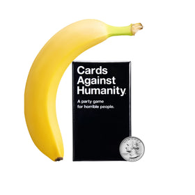 Cards Against Humanity Tiny Edition box on table, portable party fun.