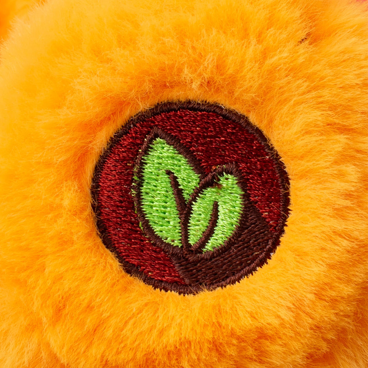 Tenderheart Bear belly badge heart highlights its caring vibe and comforting presence.