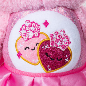 Belly badge logos presenting recognizable Care Bears branding with crossover flair.