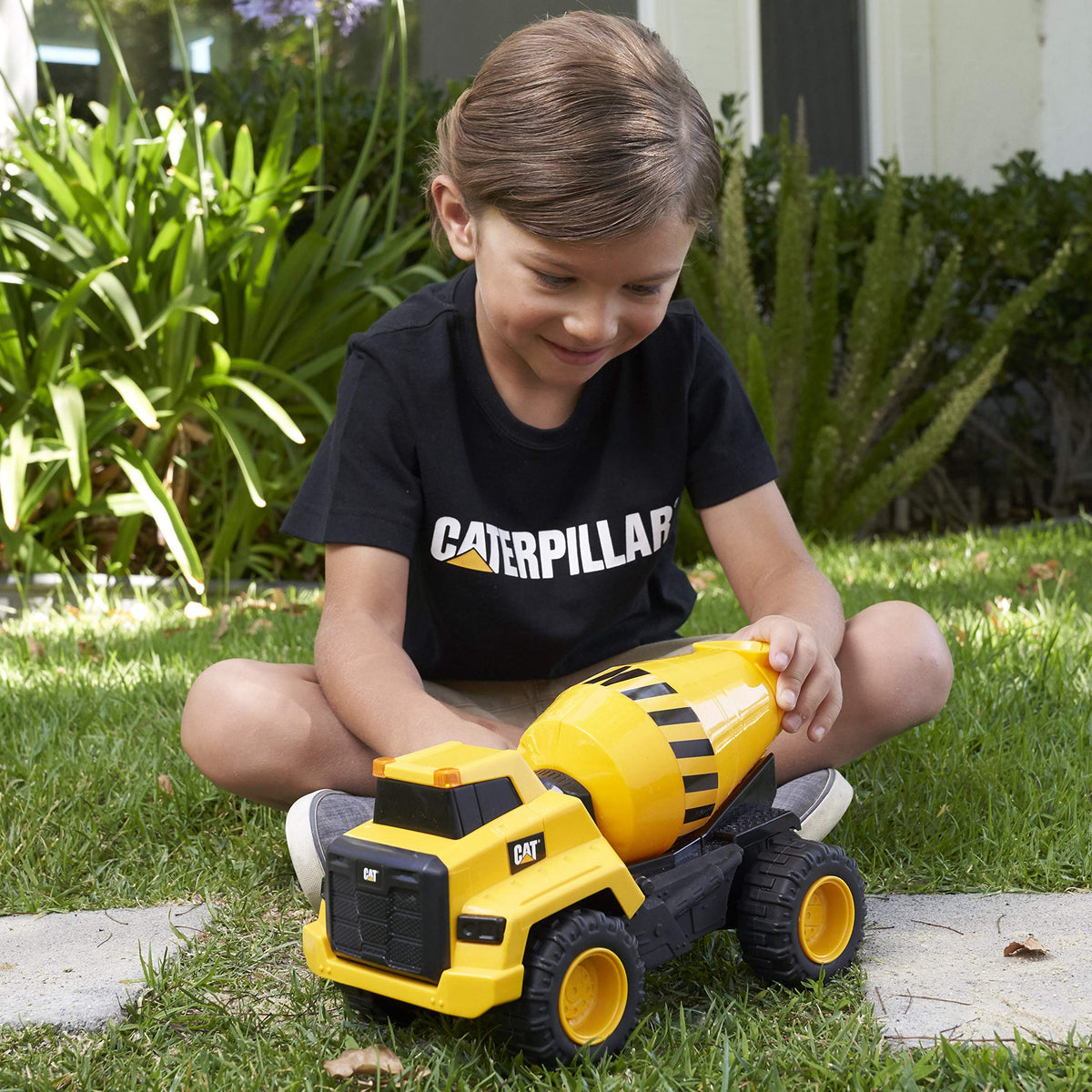 CAT cement mixer side view showcasing rugged wheels for indoor and outdoor use.