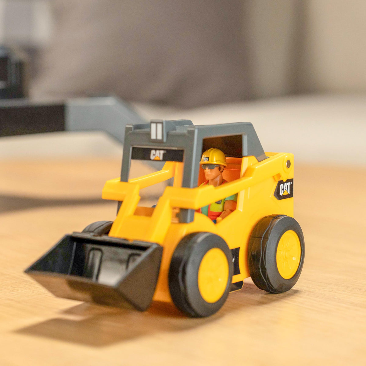 CAT Workforce 4-inch articulated figure fits both cab and skid steer for interactive storytelling.