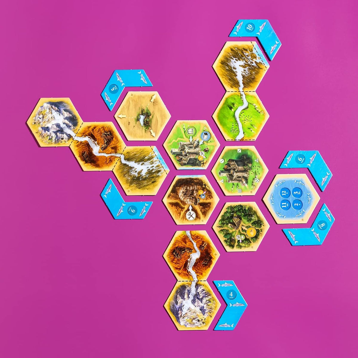 CATAN Traders & Barbarians expansion tiles expand board layouts with new trade routes.