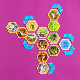 CATAN Traders & Barbarians expansion tiles expand board layouts with new trade routes.
