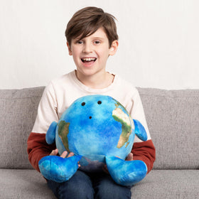 Large 16-inch Celestial Buddies plush displayed on a chair for easy handling.