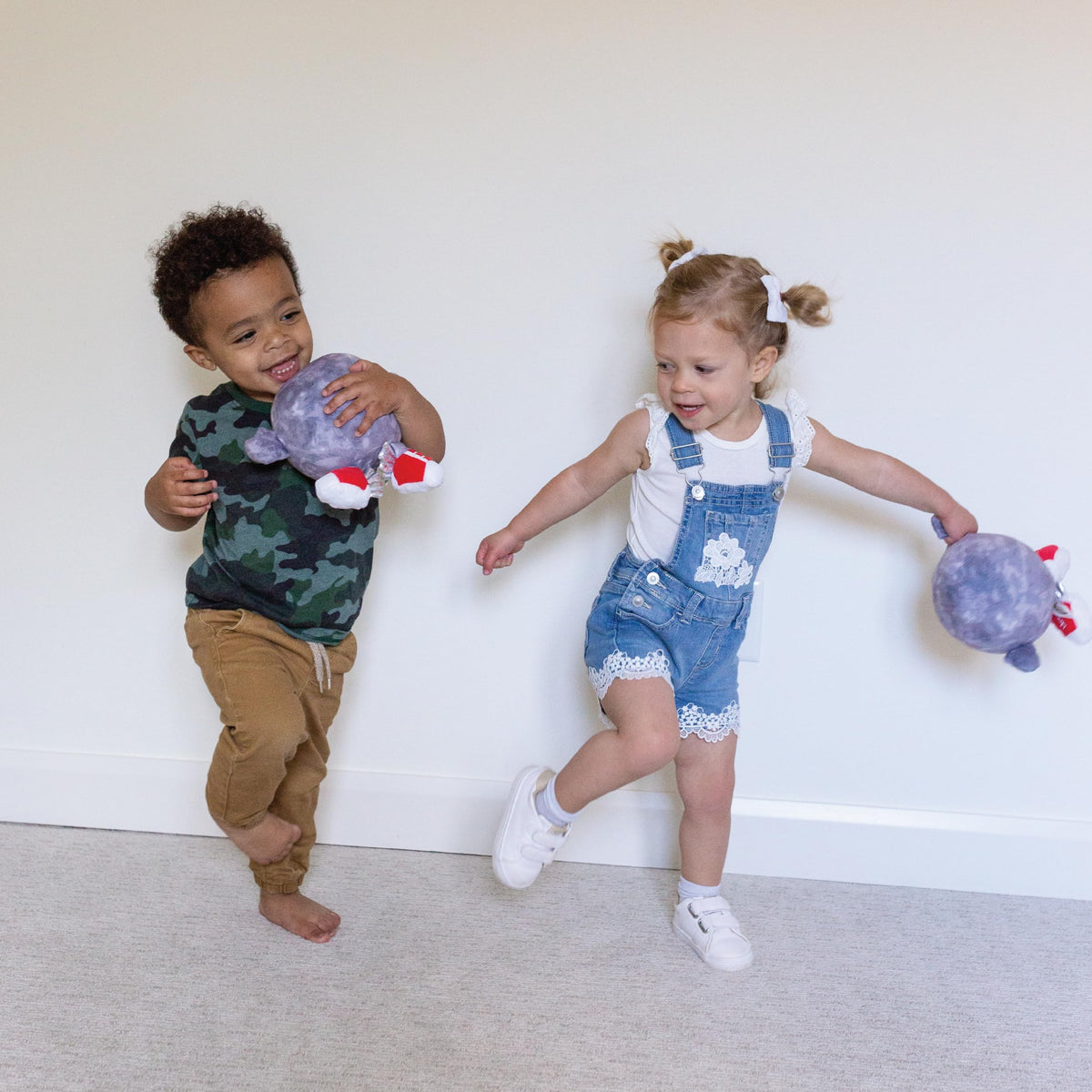 Celestial Buddies Mercury Buddy embroidery detail adds charm during story time.