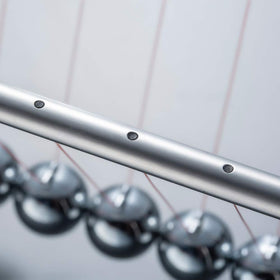 CERROPI Newton cradle includes an extra ball for extended demonstrations