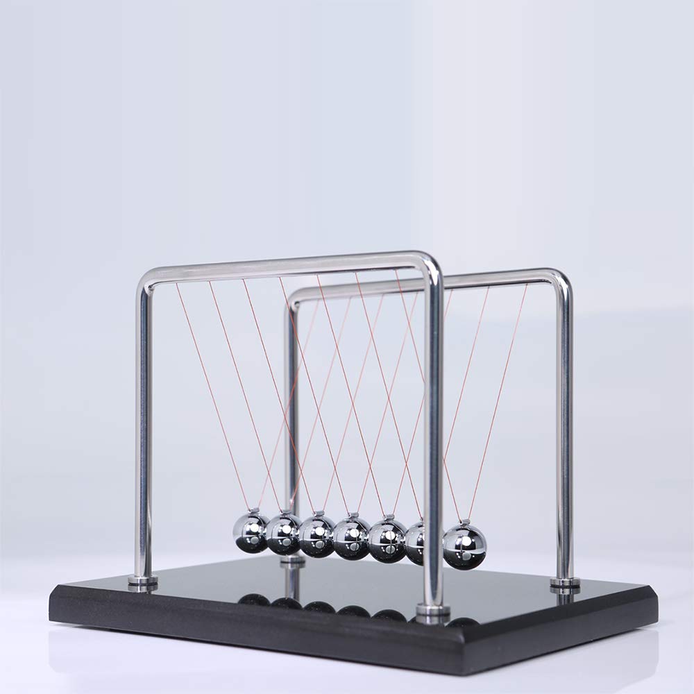 CERROPI Newton cradle in action demonstrating pendulum motion on desk