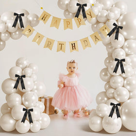 Charnoel black bow for balloon arch adds retro touch
