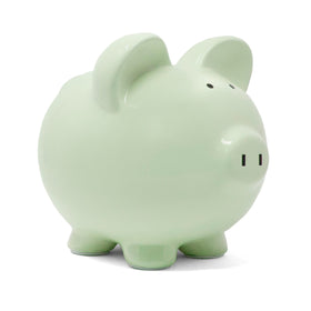 Child to Cherish green piggy bank in a nursery setting for decor and savings.