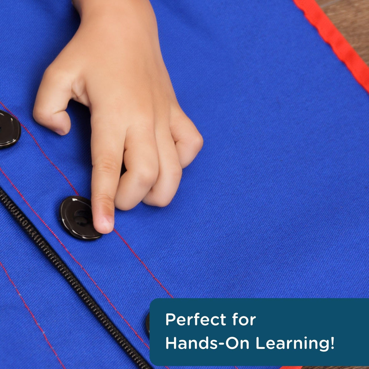 Children's Factory Combo Zipper Vest blue button close-up demonstrating buttoning practice in action