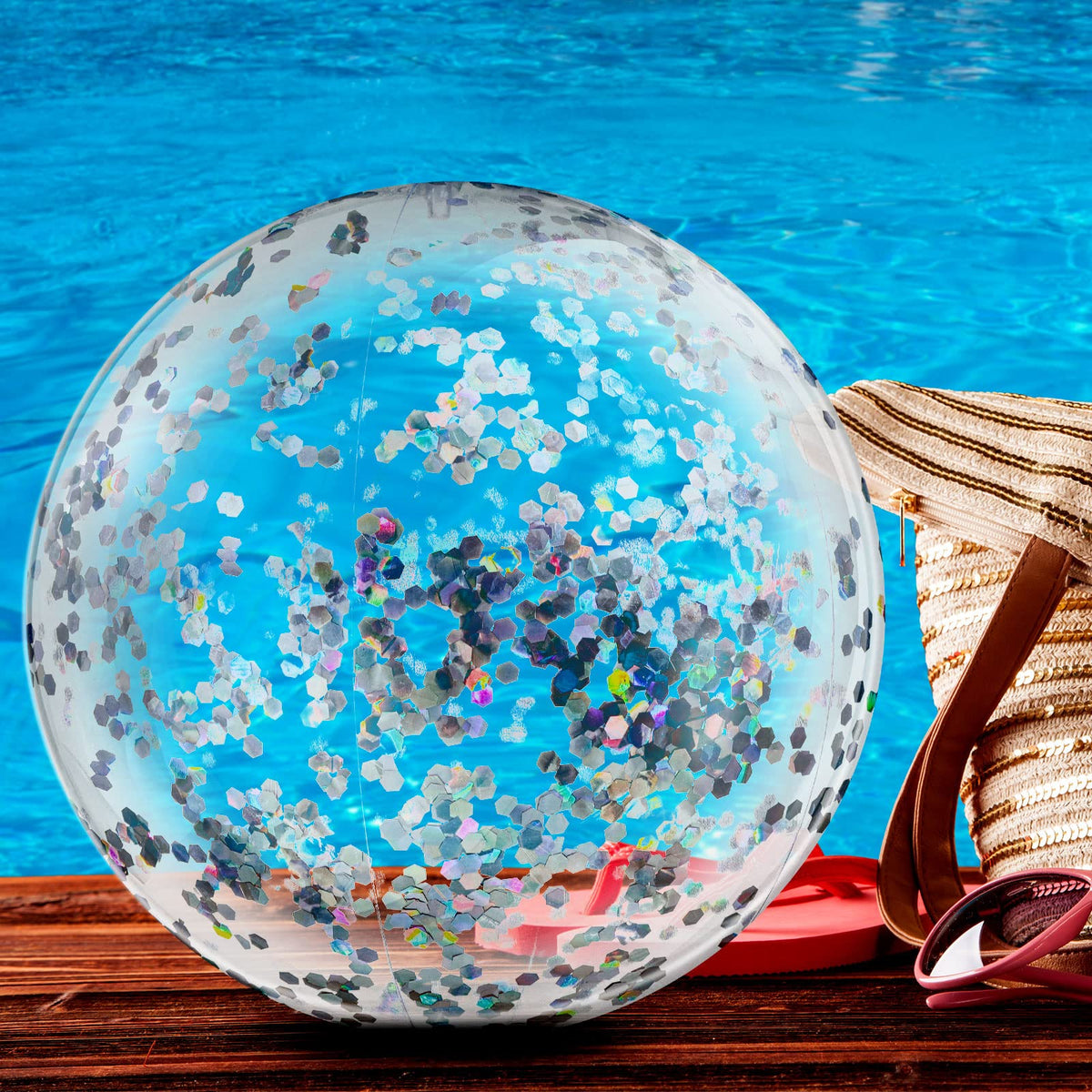 Civaner inflatable pool ball with sparkling sequins catches light during a splash.