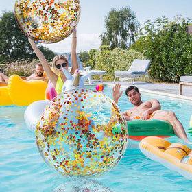 Civaner glitter balls at a poolside party create a shimmering focal point.