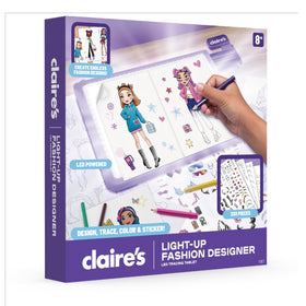 Claire's Light-Up Fashion Designer Tablet hidden storage compartment keeps supplies tidy