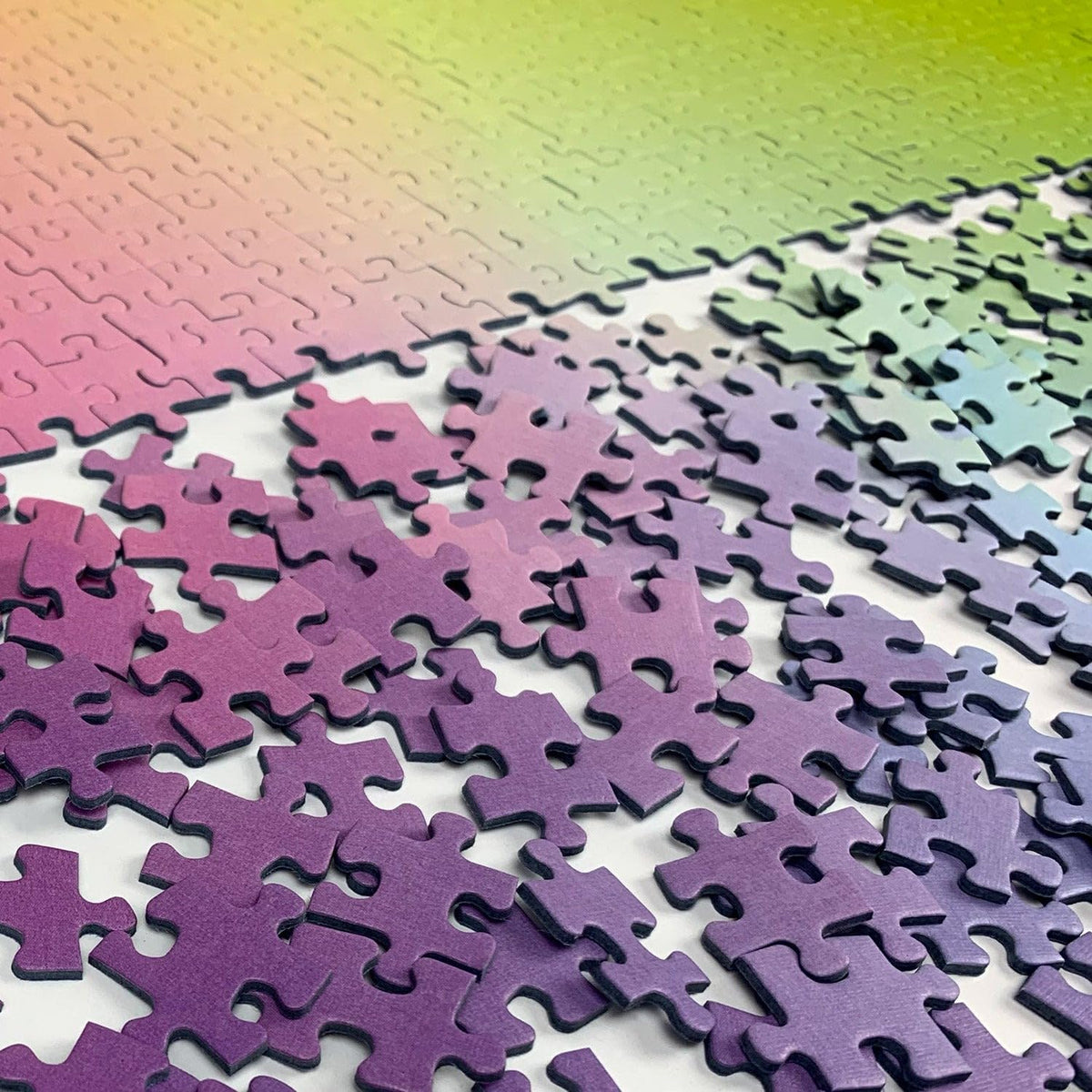 Cloudberries Gradient Puzzle on coffee table evokes calm, inviting puzzling sessions