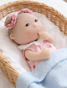 Cloveray potato baby doll thumb-sucking pose encourages gentle pretend play.
