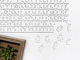 CM Originals Clearly Impossible puzzle table setup inviting adult puzzlers to teamwork
