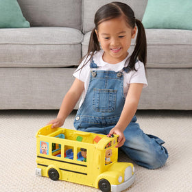 CoComelon Transforming School Time Bus playground area with swings for active fun