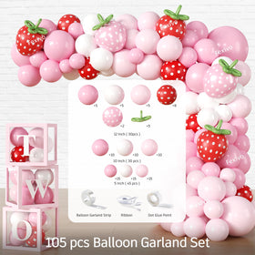 Cocomigo strawberry balloon boxes create clear, photo-ready 'TWO' accents