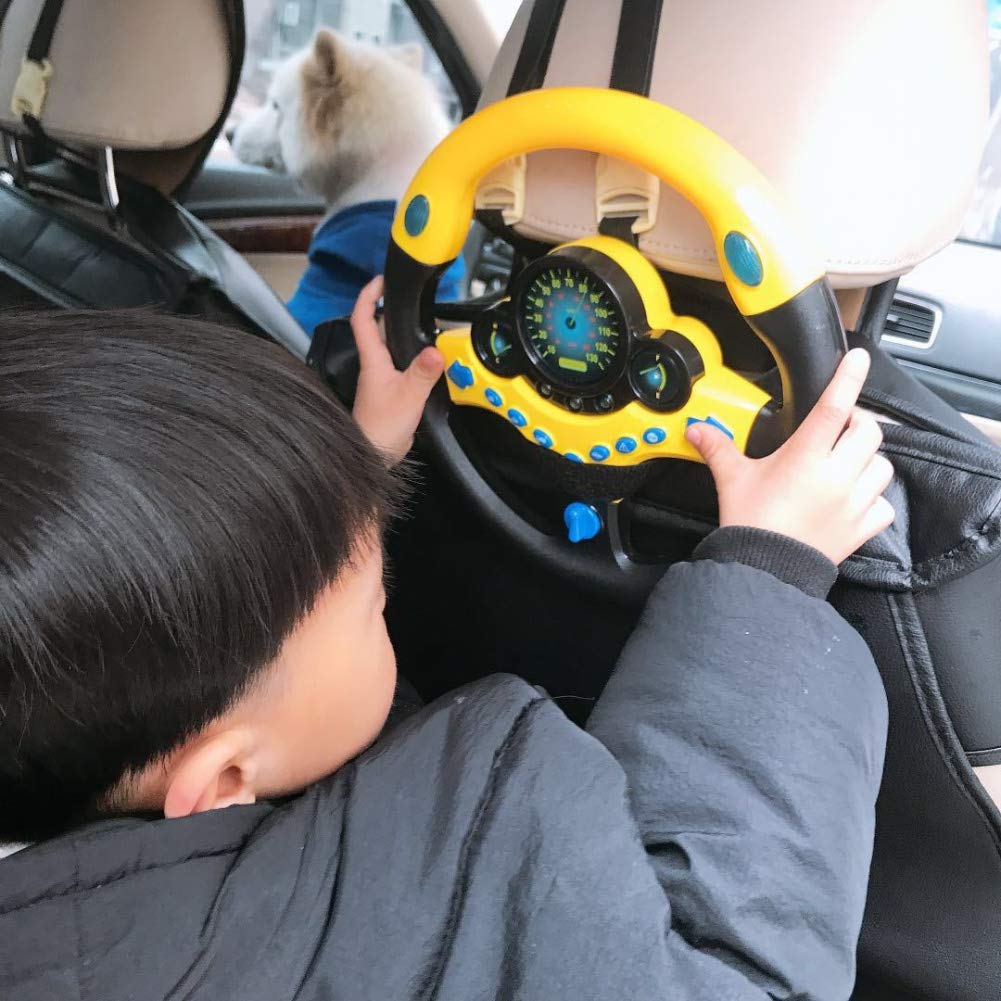 Coherny steering wheel dashboard close-up shows responsive buttons for imaginative play.