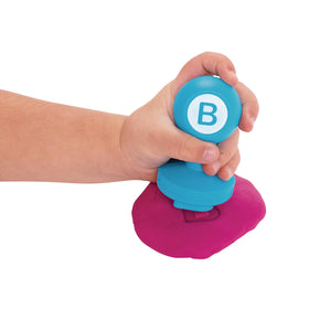 Colorations classroom activity setup with Alphabet Dough Stampers for group stamping.