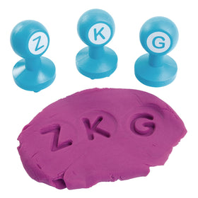 Colorations Alphabet Dough Stampers create colorful dough imprints for learning.