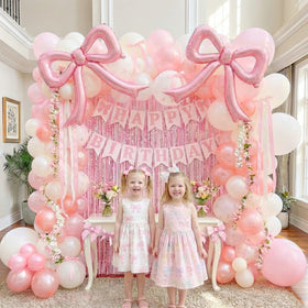ColorToyz Pink Metallic Tinsel Curtains create dazzling backdrops for photos.