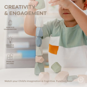 Comfy Cubs tower-stacking play image highlights balance challenges that support early problem-solving.