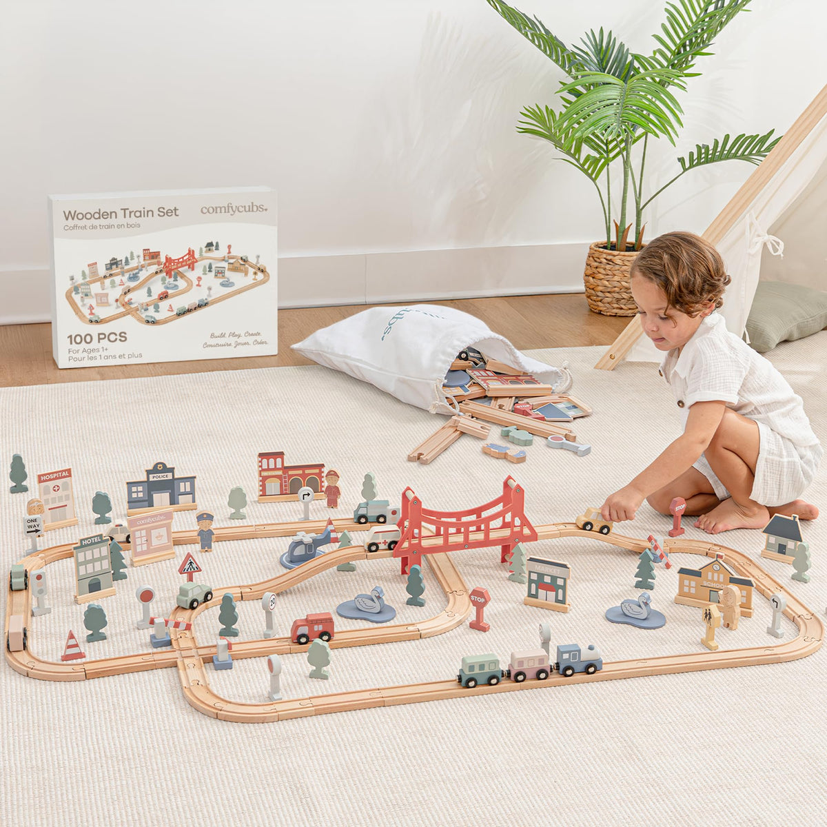 Comfy Cubs wooden train tracks invite toddlers to hands-on, imaginative layout design.