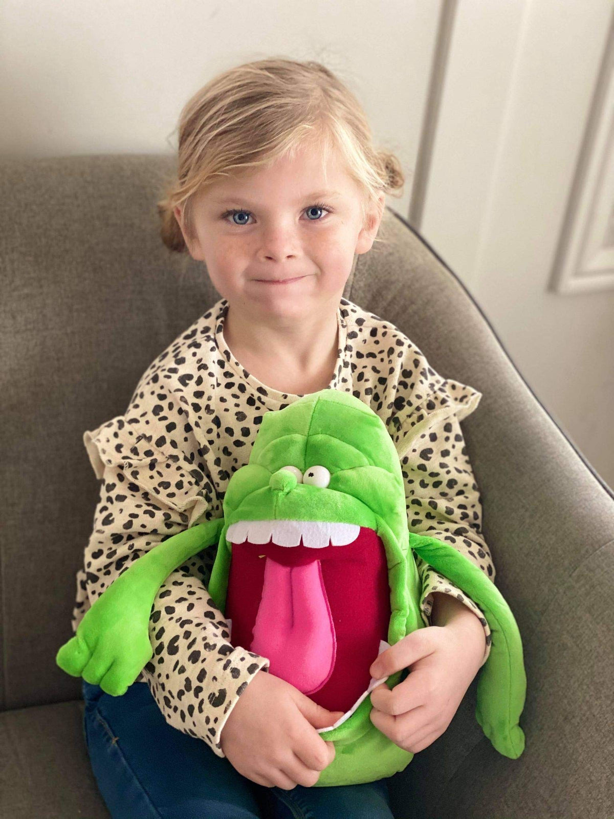 CONHENCI Slimer doll in a hugging pose for companionship.