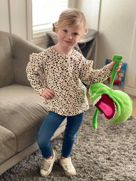 CONHENCI Slimer doll in a kids' room decor setup.