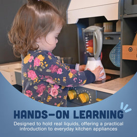 Constructive Playthings toy kitchen setup showing kids' hands exploring pretend cooking.