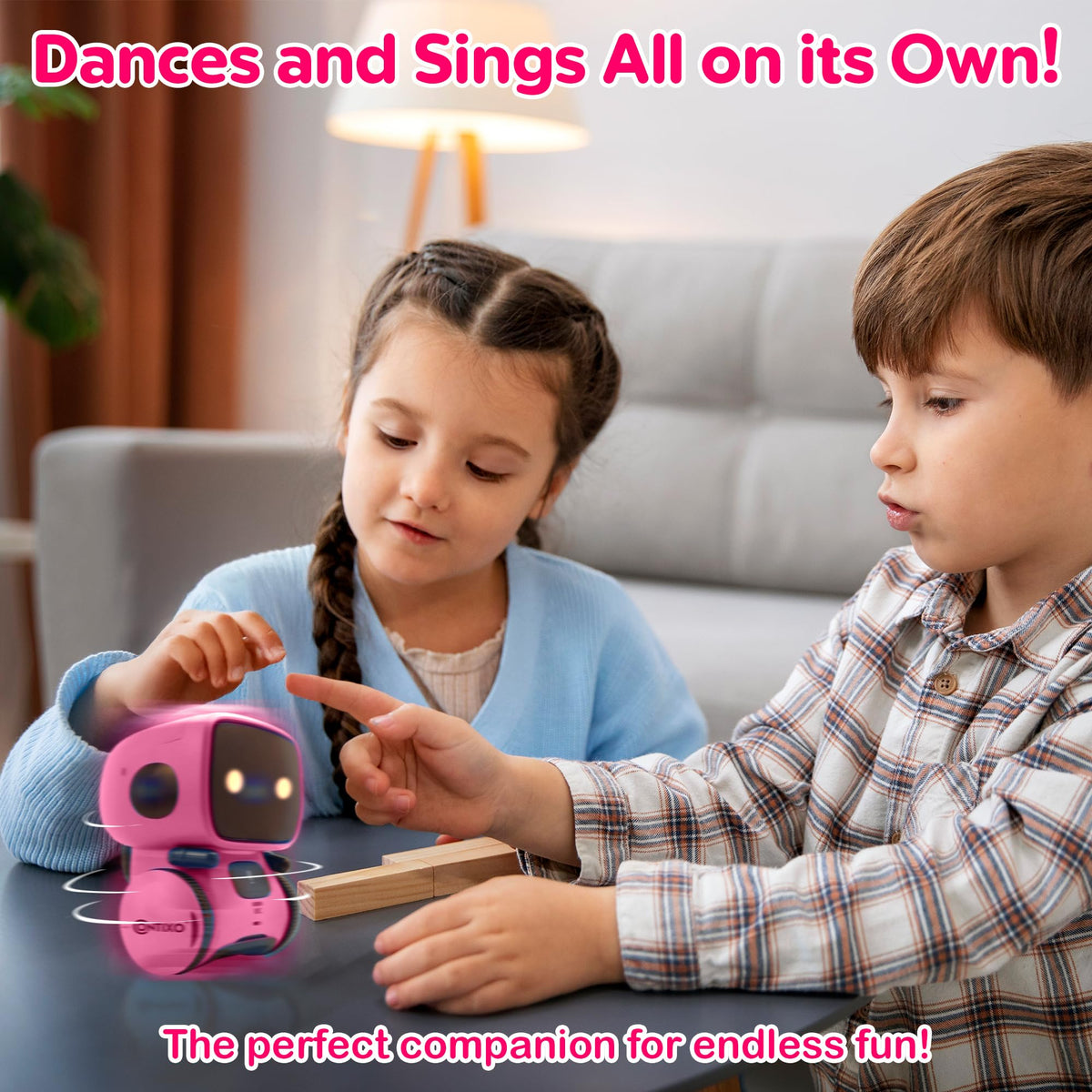 Contixo R1 pink robot toy, performing a dance motion in action.